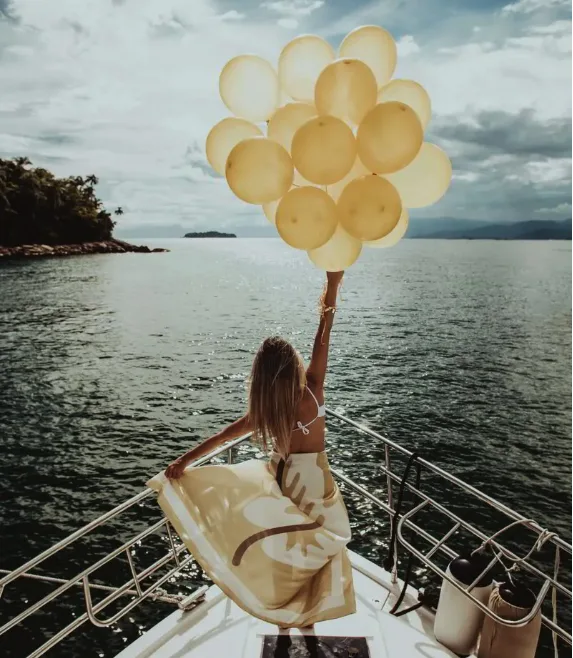 Guests toasting at a private birthday yacht party